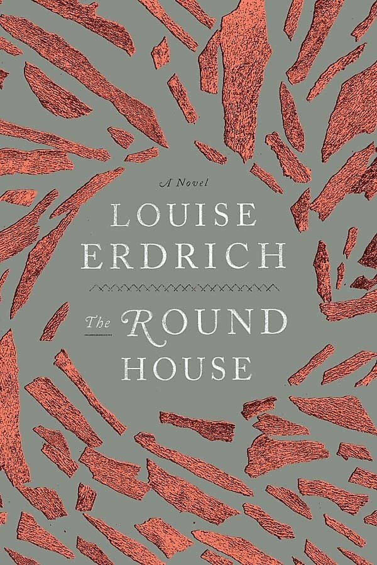 Grey background with textured reddish shards of brick