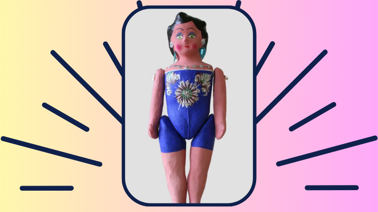 Traditional paper mache doll with black hair, painted-on purple clothes, and beaded jewelry.